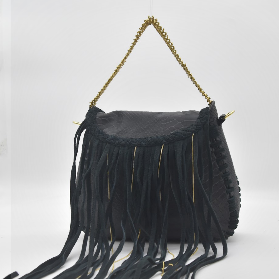 Model wearing MEA fringe bag crossbody, gold chainmail trim