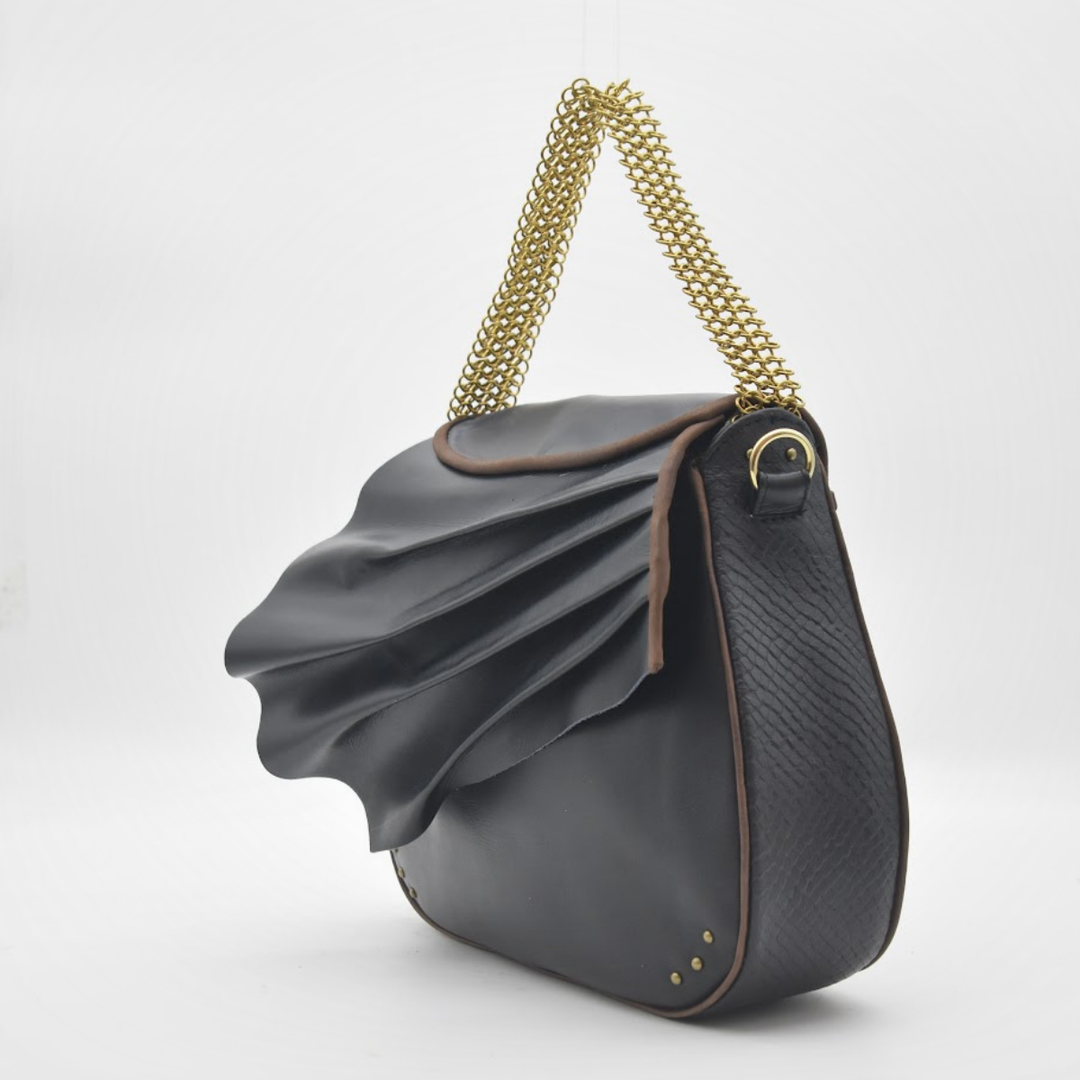ISIS sculpted black leather saddle bag, handmade in our atelier