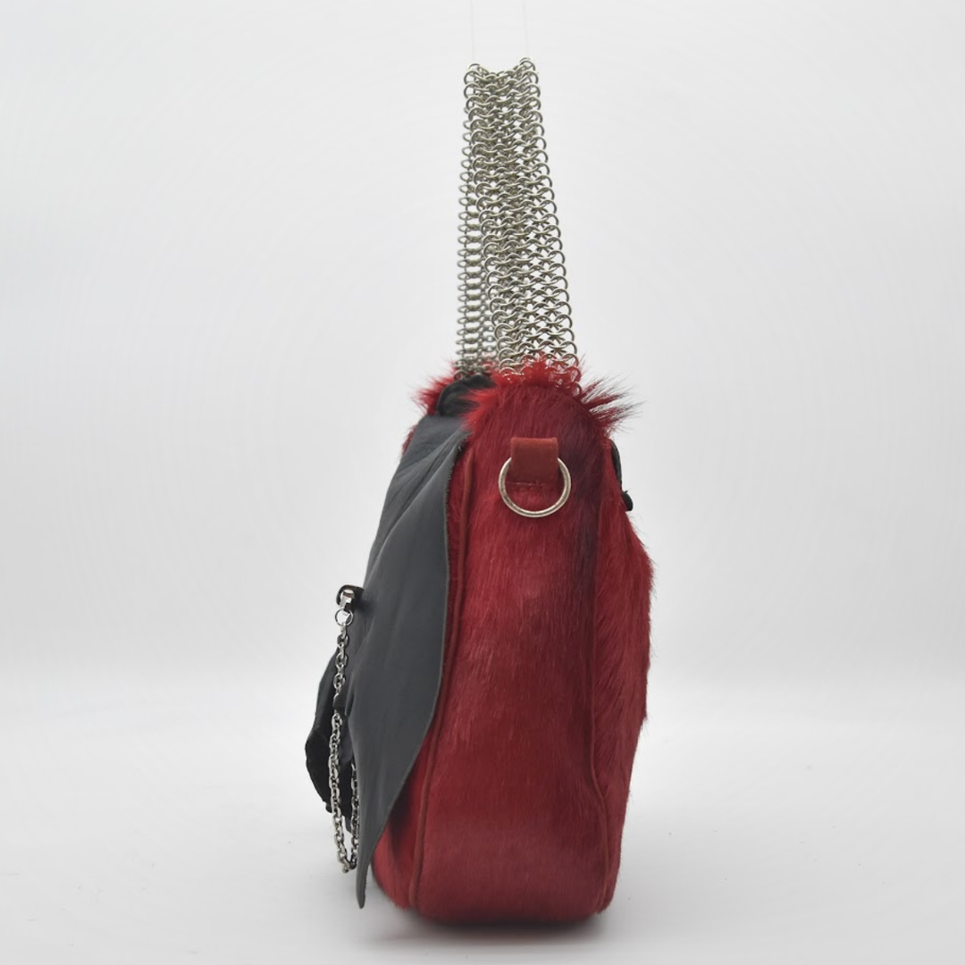 RED RUBY springbok body painted fire red, hand-set brass toggle detail