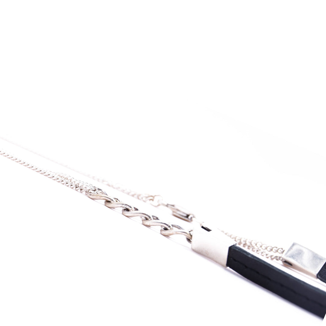 KENZA necklace close-up, silver chain and leather detail