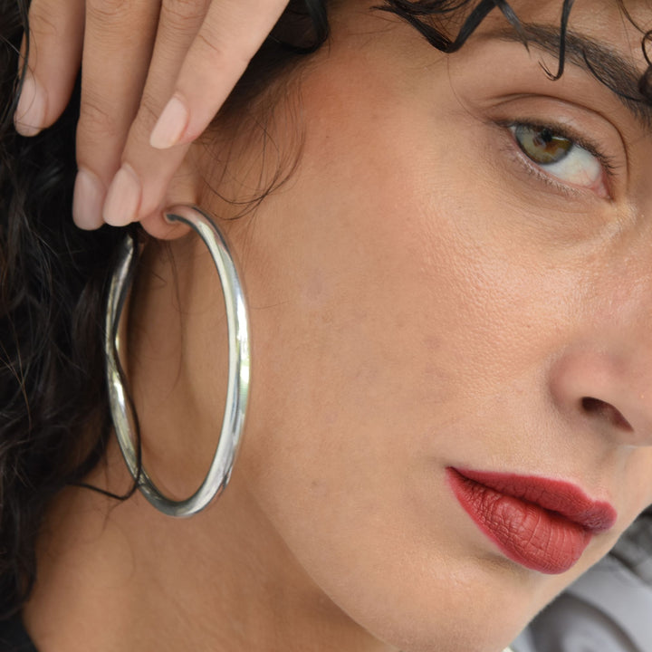 EALGA 7cm sterling silver hoop earrings worn, handmade minimalist jewellery