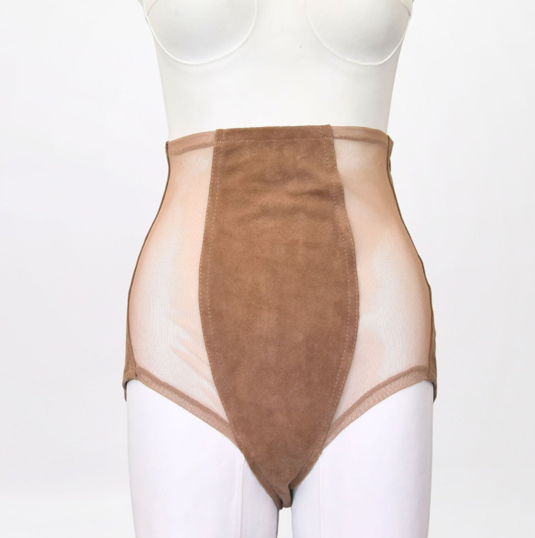Mannequin wearing a beige bodysuit on a white background