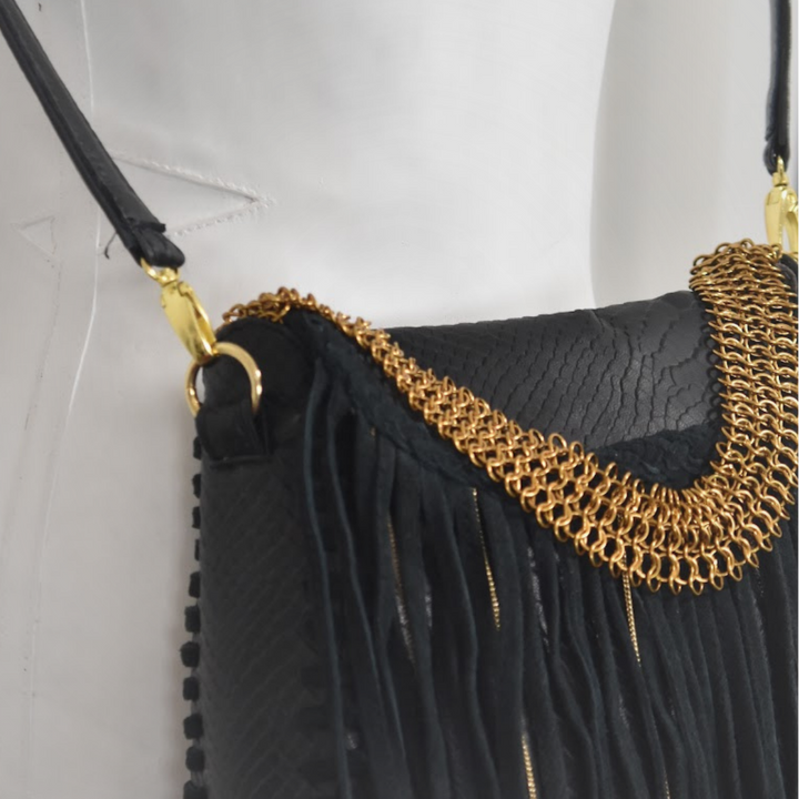 MEA shoulder bag with crossbody strap, black snake-embossed leather with structured base
