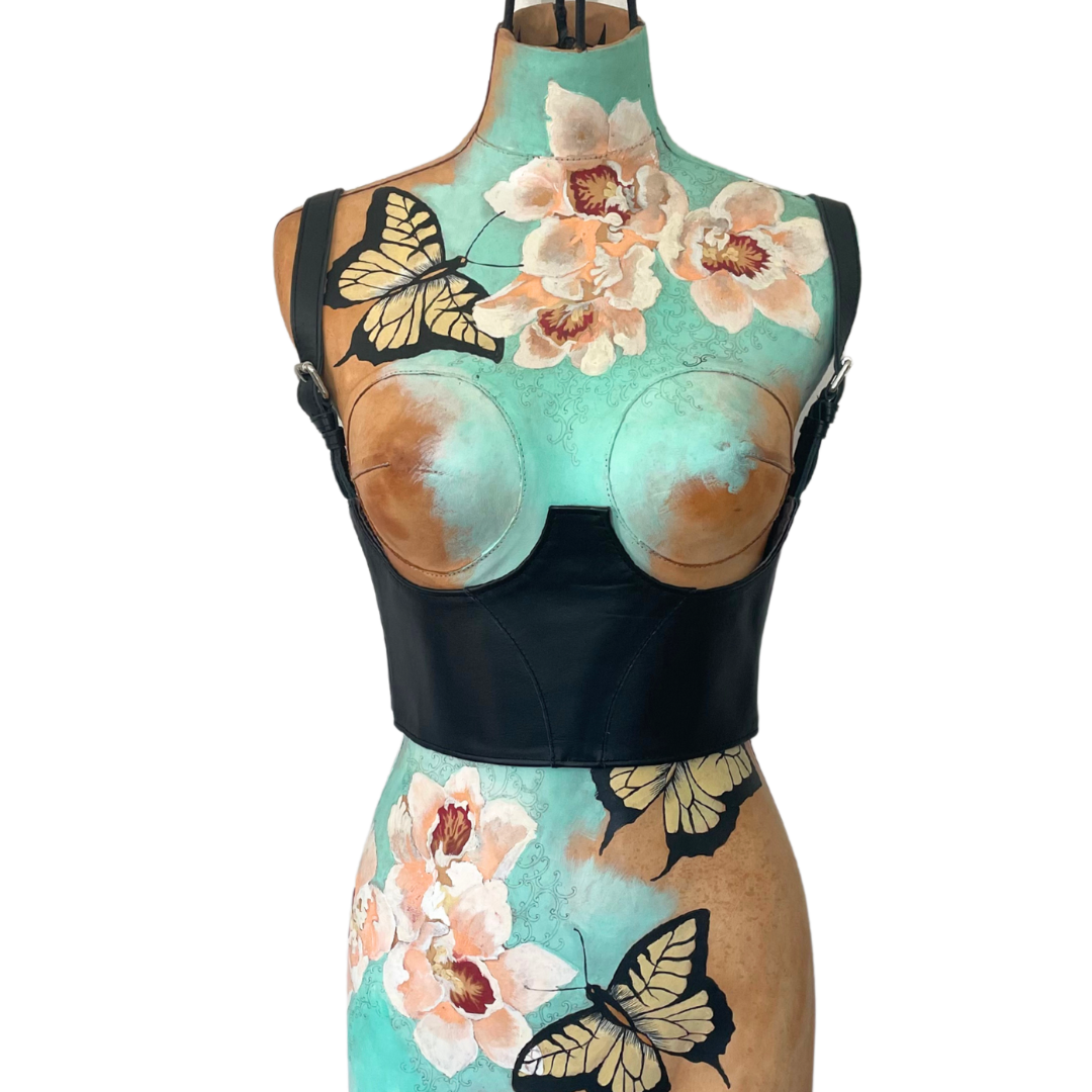 Silvy under-bust corset belt in black leather with brass buckles, handcrafted by Patricia Bos Designs — elegant, sculptural, and sensually structured.